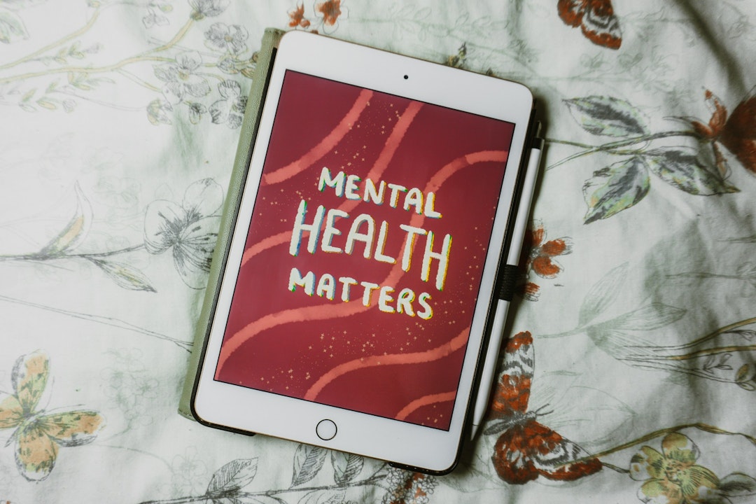 A tablet with the words Mental Health Matters on the screen.
